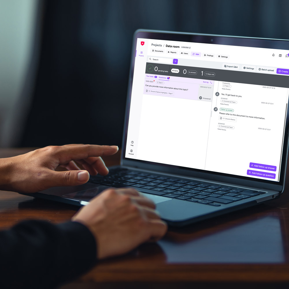Person using laptop on Drooms data room